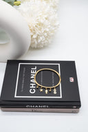 Χρυσή χειροπέδα charms